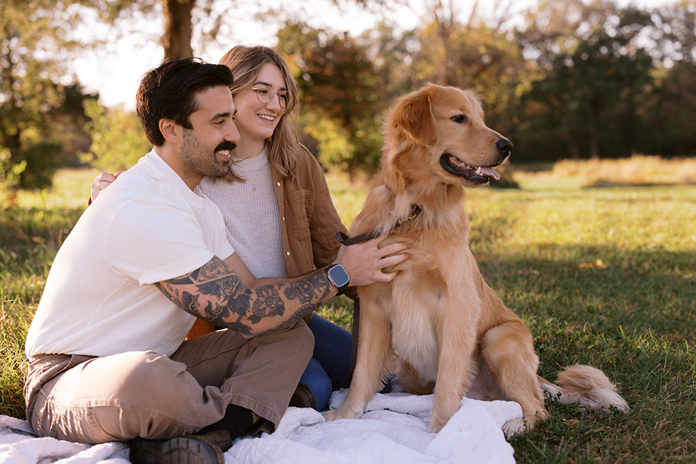 Couple with golden retriever